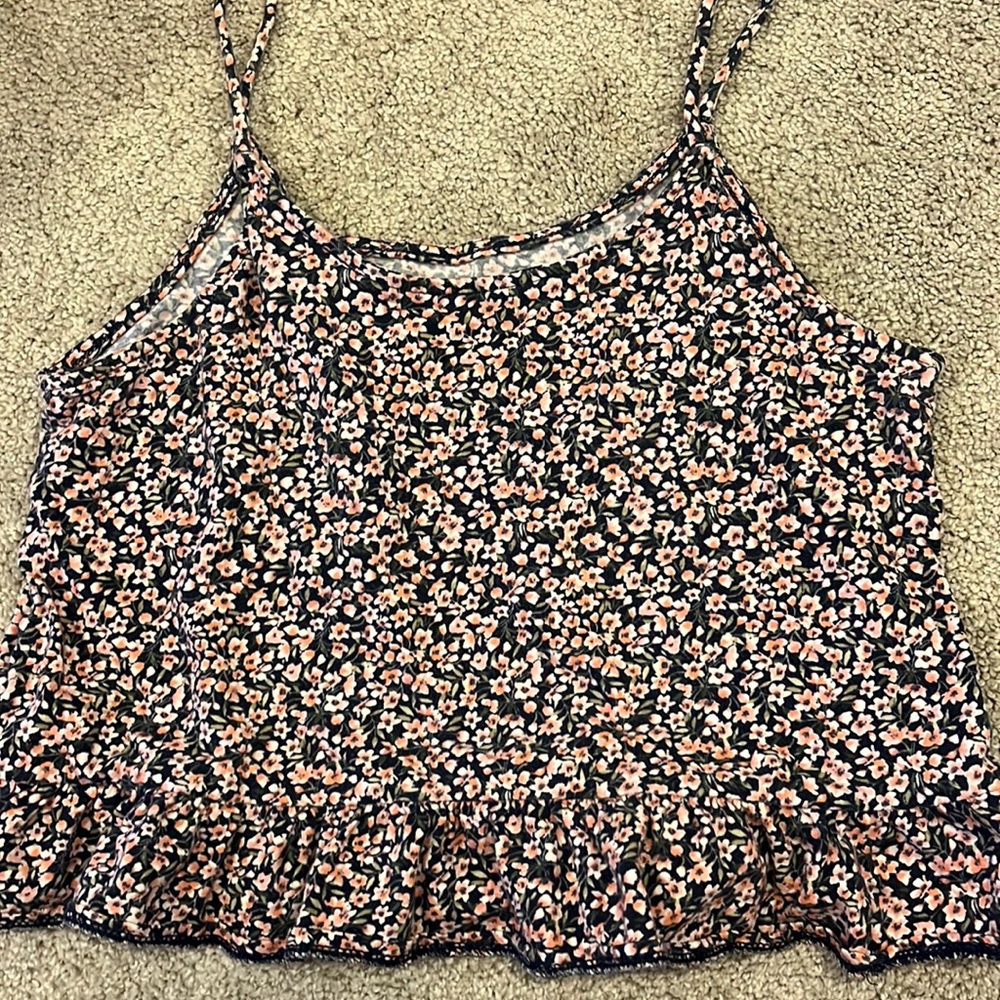 I am selling a tank top slash crop top with flower print